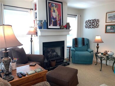 Family room with built in bookcase on fireplace