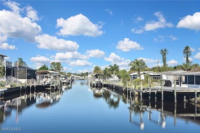 Dock area featuring a water view and boat lift