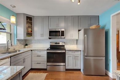 Updated Kitchen, granite countertops, SS range and fridge.