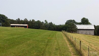 Barn to right, equipment shed to left