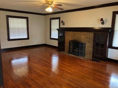 Spacious Living Room with gas starter fireplace.
