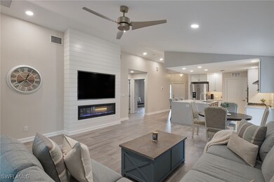 Living room with light hardwood / wood-style floor