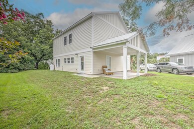 View of side of home featuring a patio area and a 