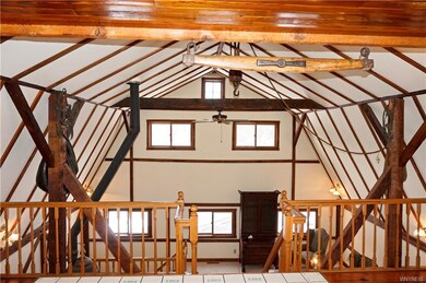 Beams and barn roof open up great room