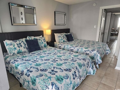 Bedroom with light tile patterned floors