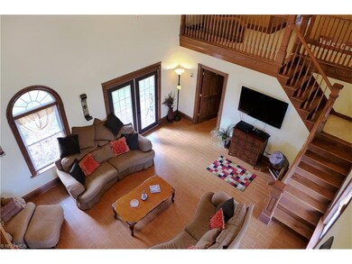 Two story Vaulted Living Room is the centerpiece o