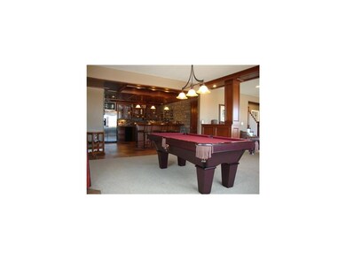 Family Room. STONE WALLS, CHERRY PANELED WOOD CEIL