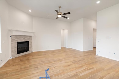 Detailed view of a fireplace and wood finished floors