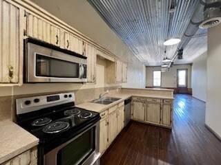 Kitchen with appliances with stainless steel finis
