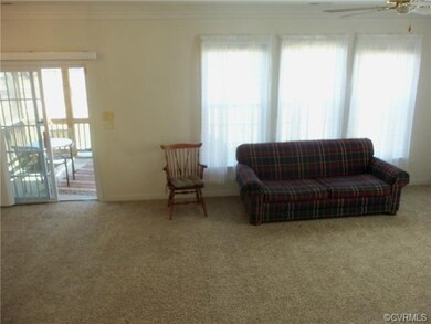 Large triple windows in the living room make for a