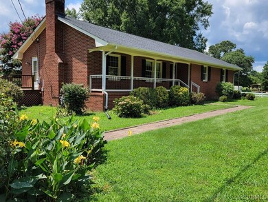 Brick rancher with front porch and rear deck
