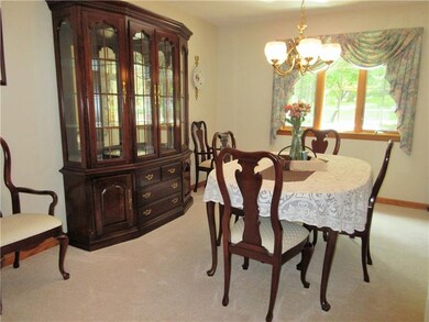 The lovely dining room features a beautiful chande