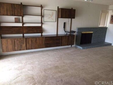 Spacious and bright living area with retro built-i