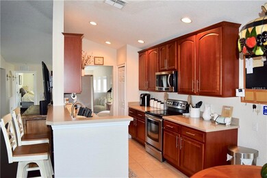 Kitchen with S/S Appliances and 42