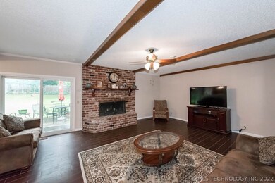 Another view of living area, patio door leads you