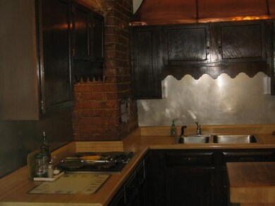 Kitchen Has Beautiful Copper Headings.