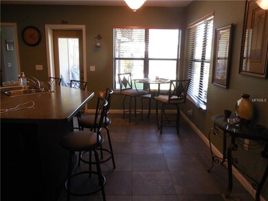 Kitchen has eat-on counter top and a breakfast noo