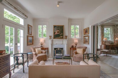 Formal Living Room-Fireplace with Marble Surround. Bleached Pre-Engineered Hardwood Floors