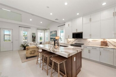 Kitchen featuring a sink, recessed lighting, backs