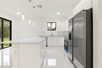 Kitchen with appliances with stainless steel finis