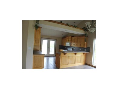 Tile floors and wood cabinets Lots of room for tho