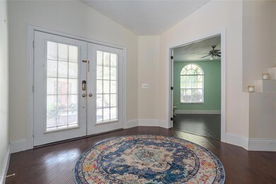 Foyer with family room behind, front door and Bedroom 4  