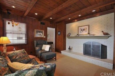 Cosy den with beamed ceilings & fireplace