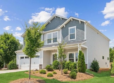 Craftsman house with concrete driveway