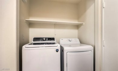 Washroom featuring washer and dryer
