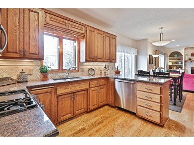 Spacious kitchen offers beautiful hardwood floorin