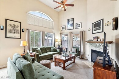 Living room featuring high vaulted ceiling, a ceil