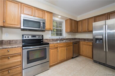 kitchen with tiled floors, stainless steel applian