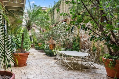 Courtyard onlooking attached carriage house