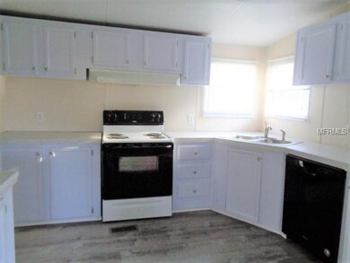 Kitchen with dishwasher, vinyl plank floors