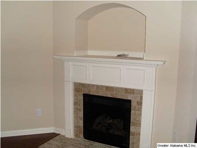 Gas Fireplace with Tile Surround.   Hardwood floor