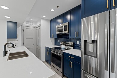 Refrigerator has ice maker and water in door.