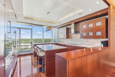 The island kitchen offers seating, granite counter