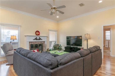 Living area with fireplace & natural light~wood fl