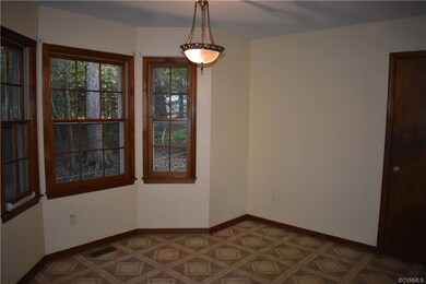 Eat-in area of kitchen.  Charming spot to sit and enjoy coffee and enjoy your wooded back yard!  Also include a pantry in the kitchen and rear door access.