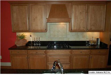 Taken from the island, looking at the gas cooktop 