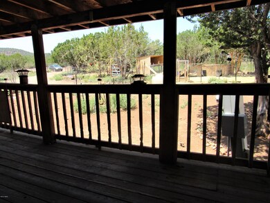 Covered deck overlooks small animal pens