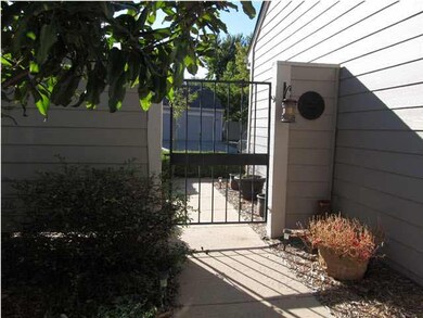 PRIVATE COURTYARD BOASTS WROUGHT IRON ENTRY GATE