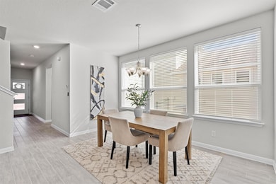 Dining room featuring a chandelier, visible vents