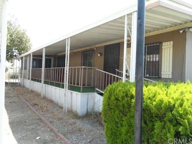 Large patio area with sun room and 2 doors for ent
