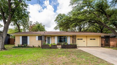 Single story home featuring brick siding, an atta