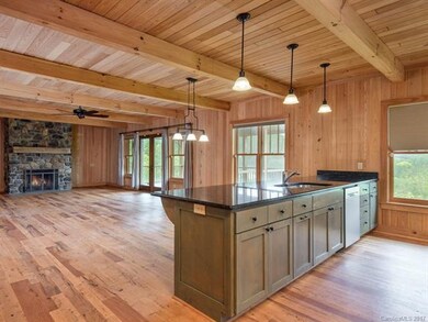 The kitchen transitions naturally into the living 