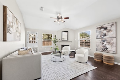 Anchored by a cozy gas fireplace and surrounded by windows, the living room offers warmth, comfort, and plenty of natural light. With backyard access and open sightlines to the kitchen and dining, it’s made for everyday living and effortless entertaining.