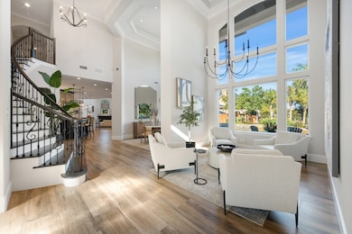 Step inside to a breathtaking two-story foyer with an elegant spiral staircase that sweeps you right off your feet.