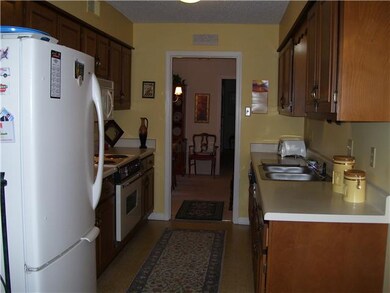 Galley kitchen with self-cleaning oven, microwave,