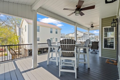 Wooden deck featuring a ceiling fan and a resident